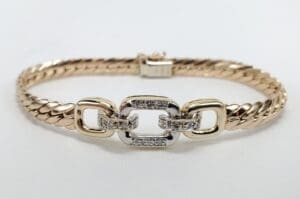 Gold and silver bracelet with linked design.