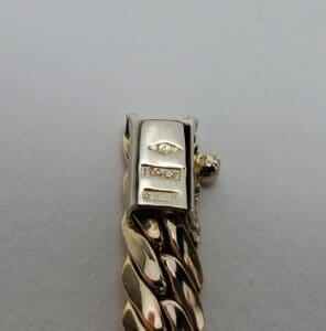 Gold chain clasp with "Italy" engraving.