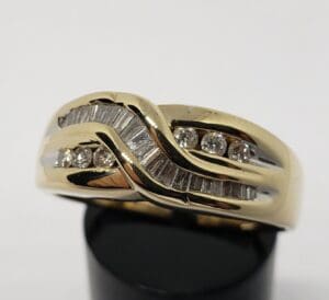 Gold ring with diamonds and baguette stones.
