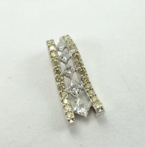 Crossed diamond and yellow gemstone pendant.
