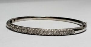 Silver bracelet with sparkling embedded stones.