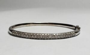 Silver bracelet with diamond accents.