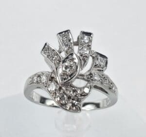 Silver ring with intricate diamond design.