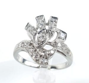 Ornate silver ring with sparkling diamonds.