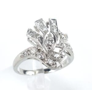 Elegant silver ring with sparkling diamond design.