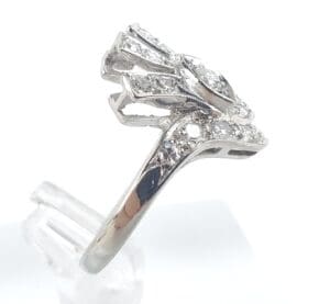 Diamond ring with intricate silver design.