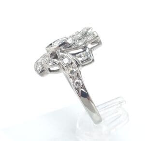 Silver ring with intricate diamond design.
