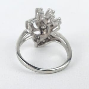 Silver ring with intricate geometric design.