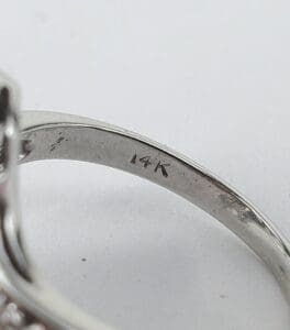 14K gold ring with engraved marking.