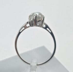 Silver ring with a single pearl.