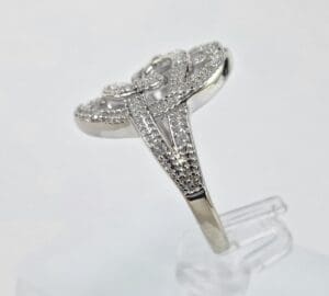 Silver ring with intricate diamond detailing.