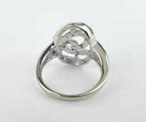 Silver ring with intricate openwork design.