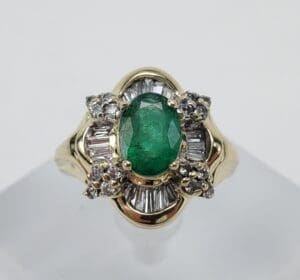 Gold ring with emerald and diamonds.