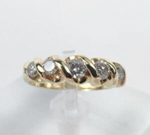 Gold ring with embedded sparkling diamonds.