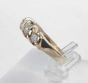 Gold ring with three diamond stones.