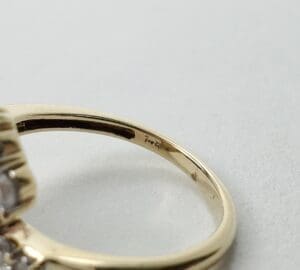 Gold ring with visible hallmark inscription.