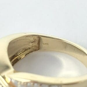 Gold ring with 14K engraving inside band.