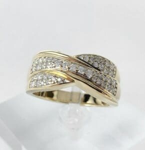 Gold ring with diamond accents on display.