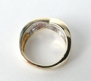 Gold and silver ring on white background.