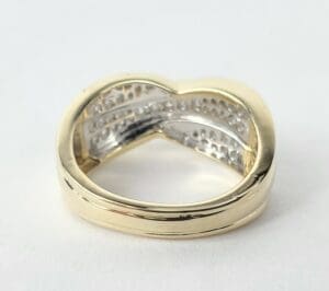 Gold ring with heart-shaped design.