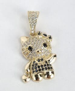 Gold cat pendant with jeweled details.