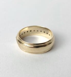 Gold ring on a white background.