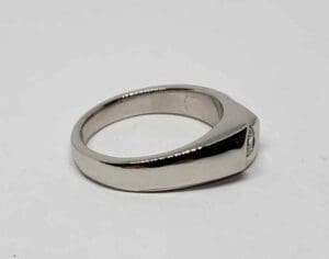 Silver ring with rectangular gemstone setting.