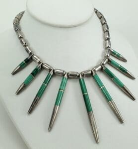 Silver and green beaded spike necklace.
