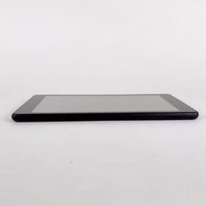 Tablet lying flat on a white surface.