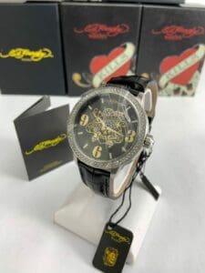Luxury watch with intricate black and gold design.