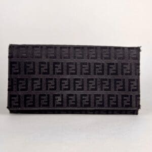 Black clutch with repeating logo pattern.