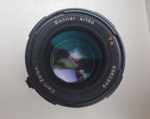 Camera lens with reflective glass surface.
