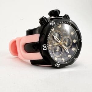 Black and pink wristwatch with multiple dials.