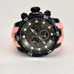 Black and pink watch with rotating bezel.