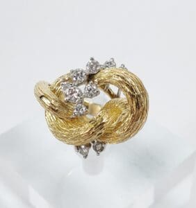 Gold ring with diamond cluster design.