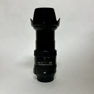 Camera lens with hood on white background.