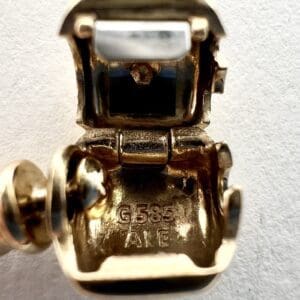 Gold jewelry clasp with G585 ALE markings.