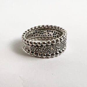 Silver beaded ring with textured design.
