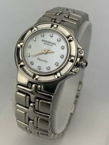 Silver Raymond Weil wristwatch with white dial.