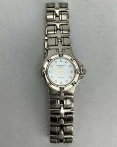 Silver wristwatch with metal bracelet band.