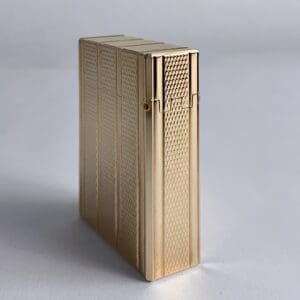 Gold, textured rectangular box on surface.