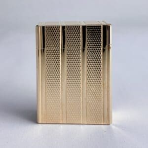 Gold textured lighter on a plain background.