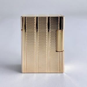 Gold textured lighter on white background.