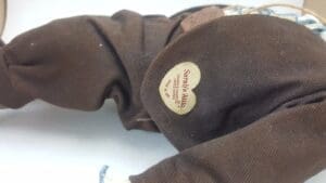 Brown fabric with heart-shaped label tag.