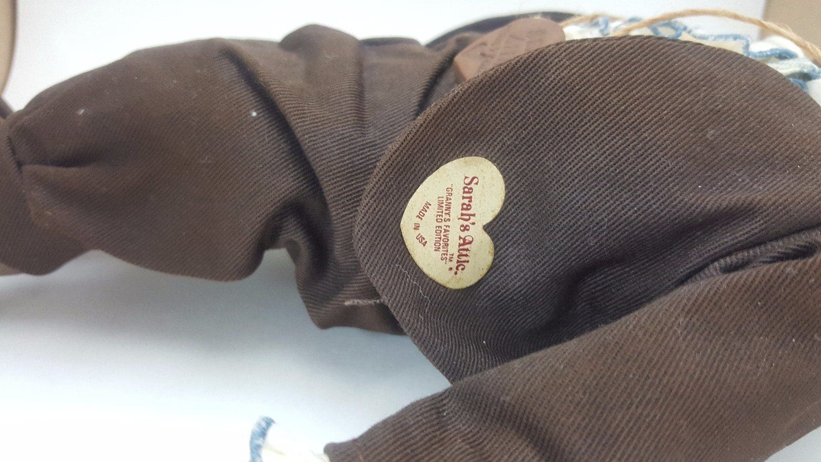 Brown fabric with heart-shaped label tag.