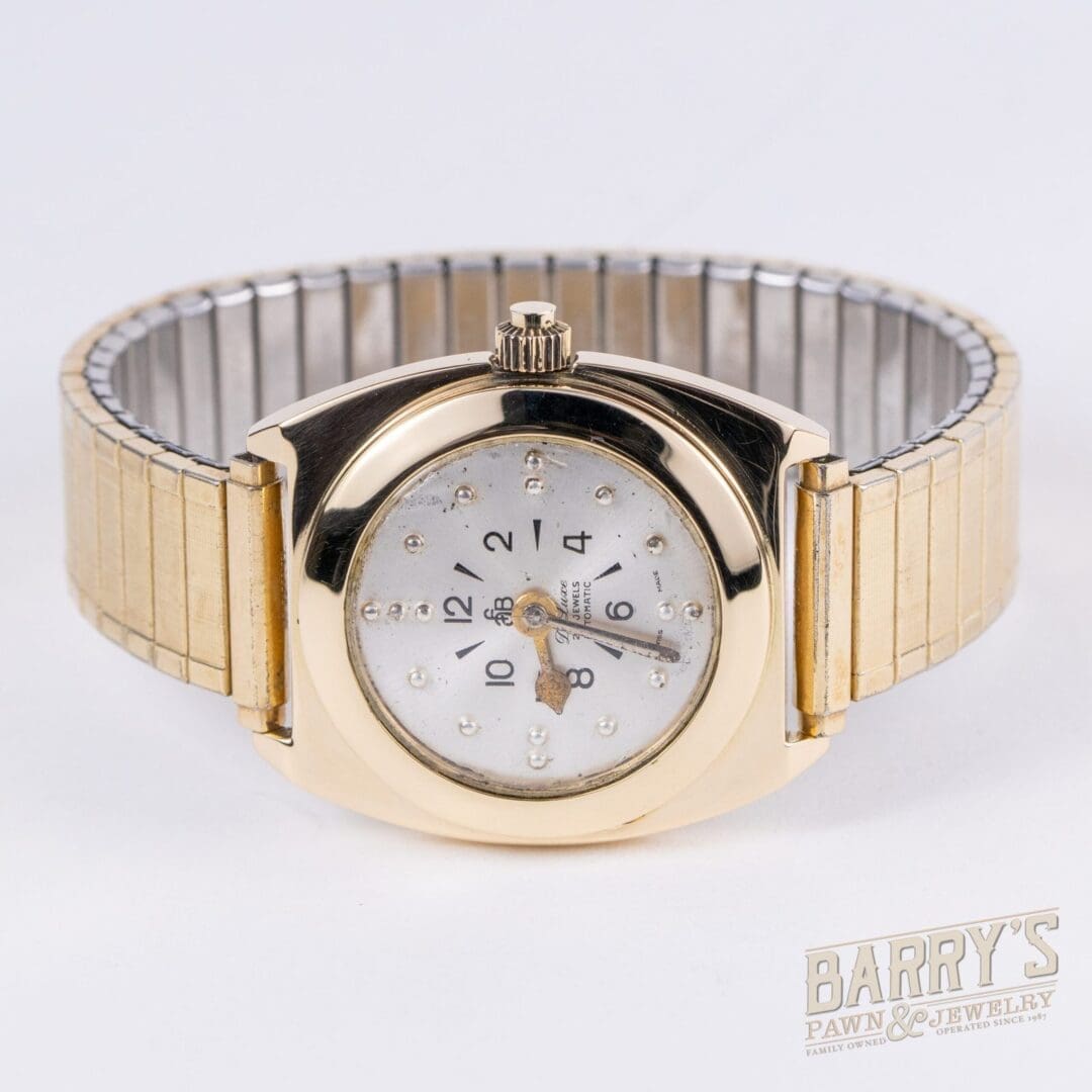 Gold watch with a diamond-studded face.