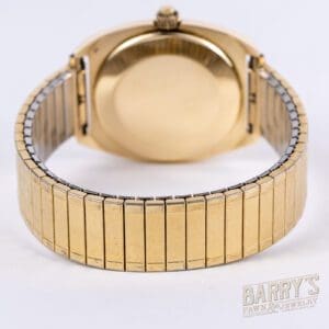 Gold watch with a linked metal band.