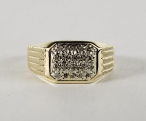 Gold ring with textured rectangular design.