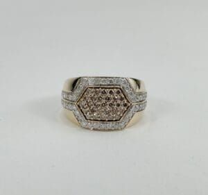 Gold ring with hexagonal diamond design.