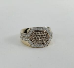 Gold ring with hexagonal diamond design.